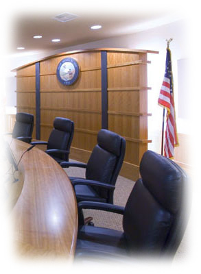 Conference room with a round table and chair around it